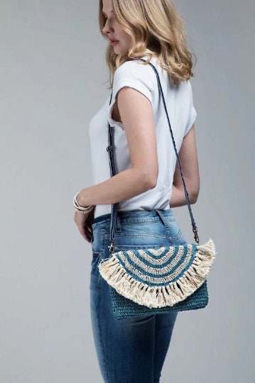 Bohemian inspired handmade jute cross-body bag featuring fringe detail with a fully lined pocket inside and a magnetic closure